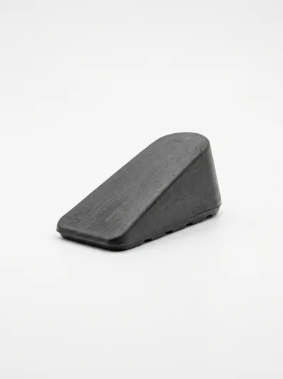 Black Rubber Wheel Chock On White Background