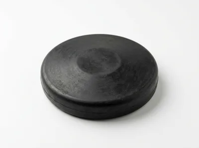 Black Rubber Hockey Puck Isolated On White Background