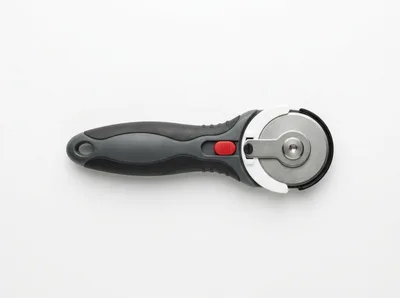 Rotary Fabric Cutter Tool on White Background