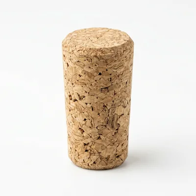 Single Natural Cork Stopper Isolated On White Background