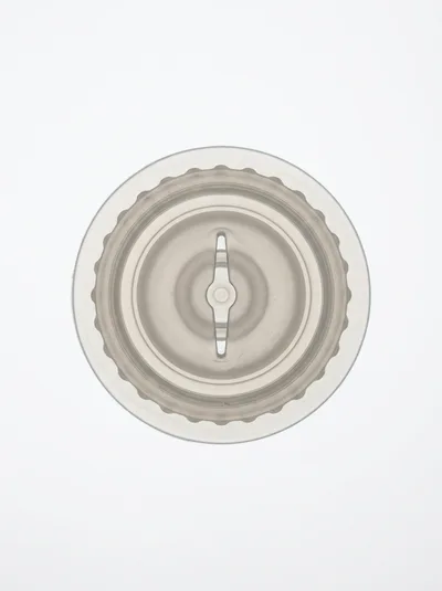 Top Down View Of A Clear Plastic Blender Lid