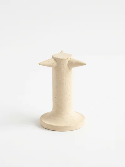 Minimalist Beige Ceramic Sculpture On White Background