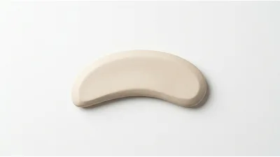 Beige Curved Ceramic Object On White Background