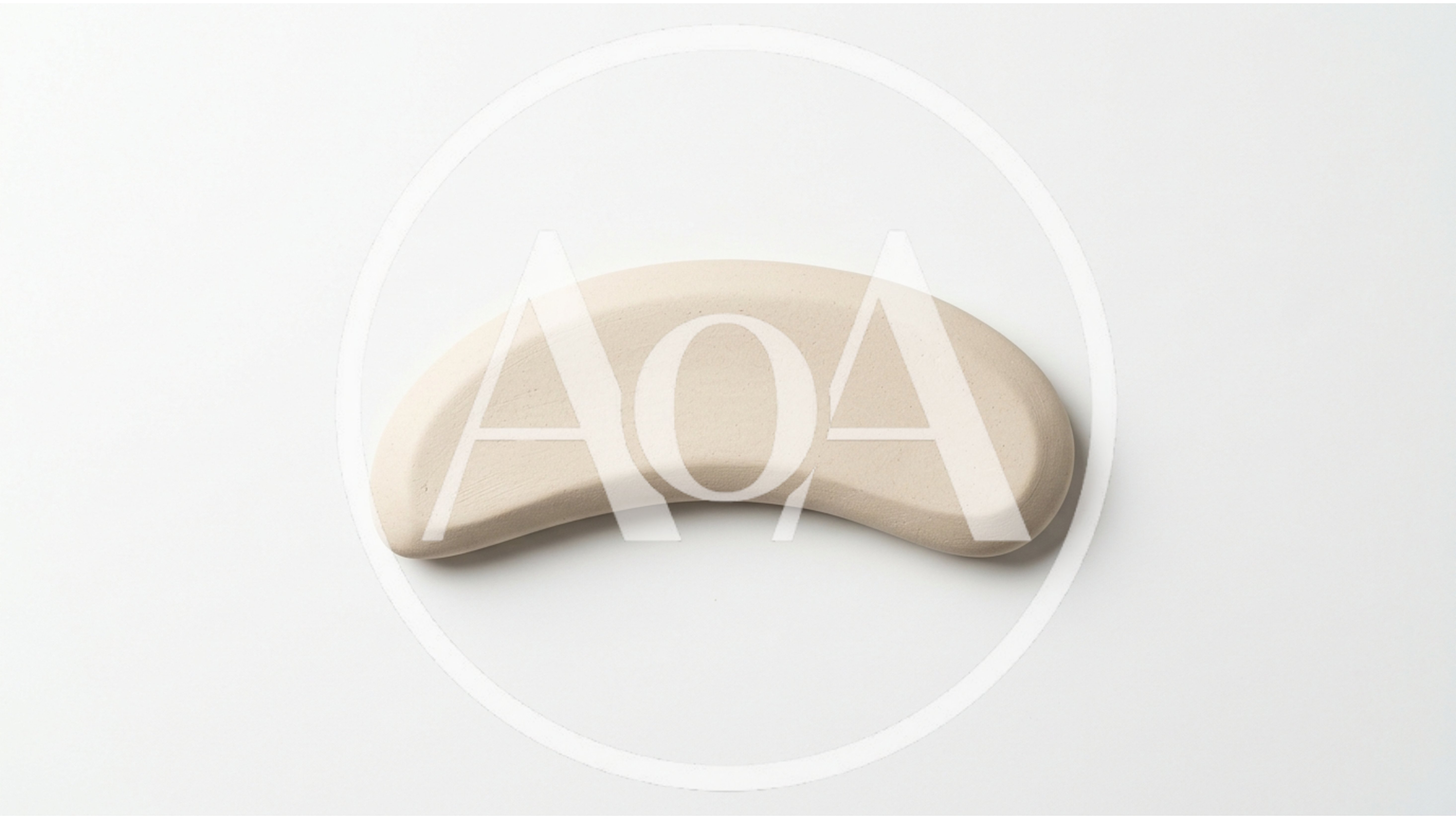 Beige Curved Ceramic Object On White Background
