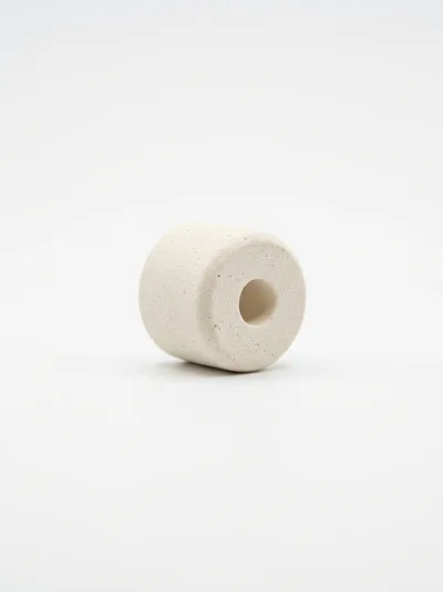 Single White Ceramic Cylinder Bead On White Background