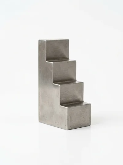 Metal Staircase Shaped Block On White Background
