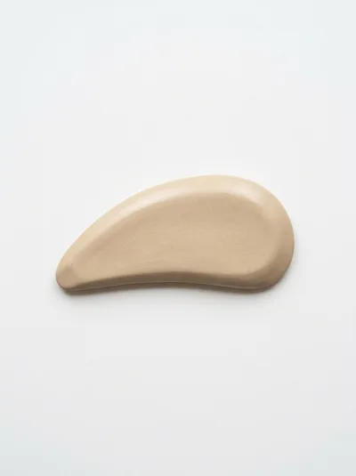 Beige Cosmetic Cream Swatch on White Background