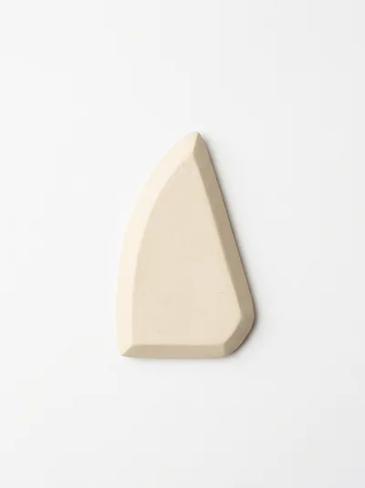 Minimalist Beige Ceramic Geometric Sculpture On White Background