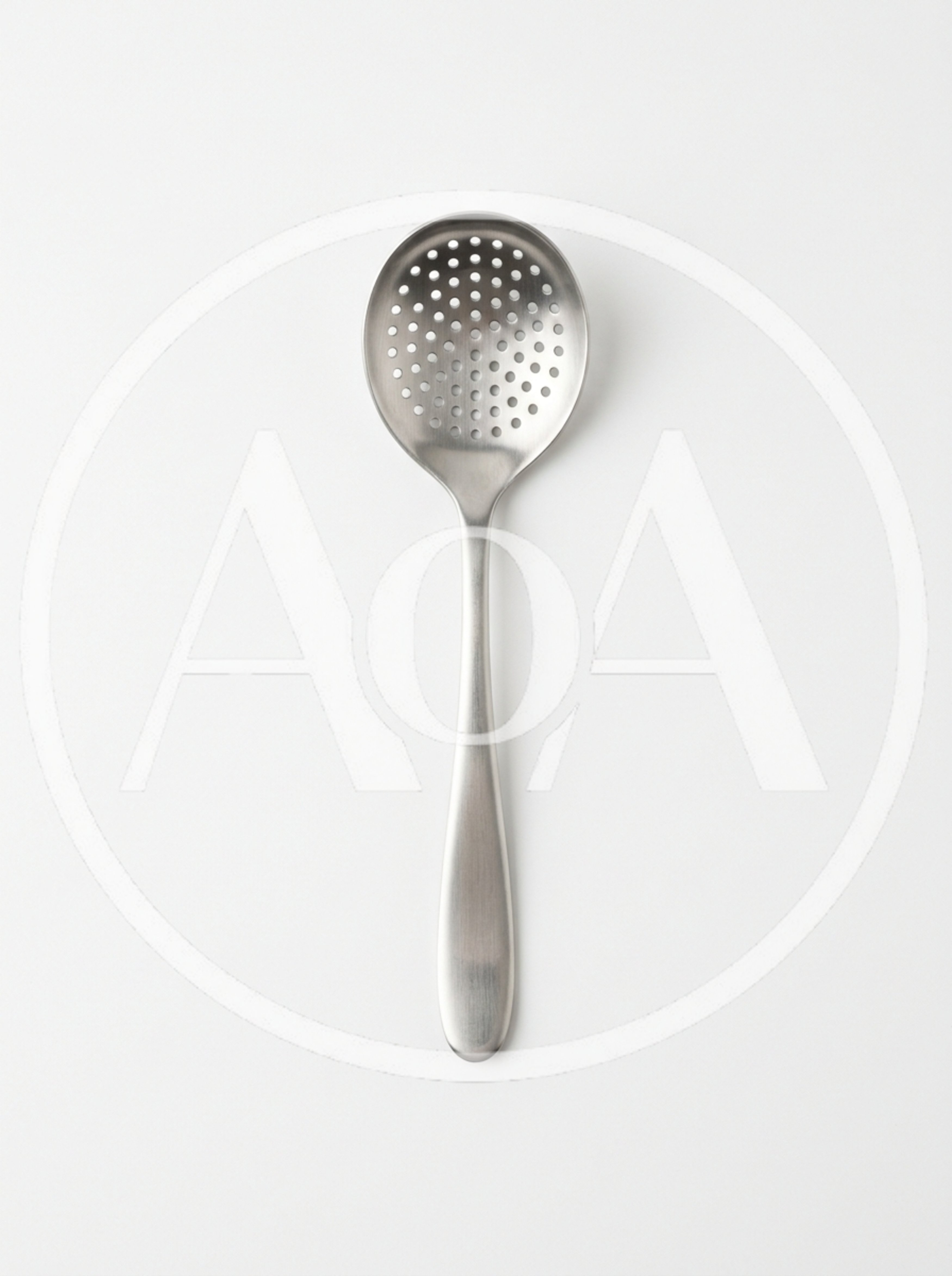 Stainless Steel Slotted Spoon On White Background