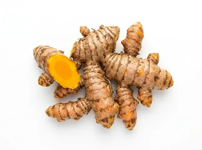Fresh Turmeric Rhizomes On White Background