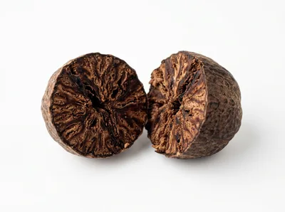 Two Halves Of A Whole Nutmeg Seed