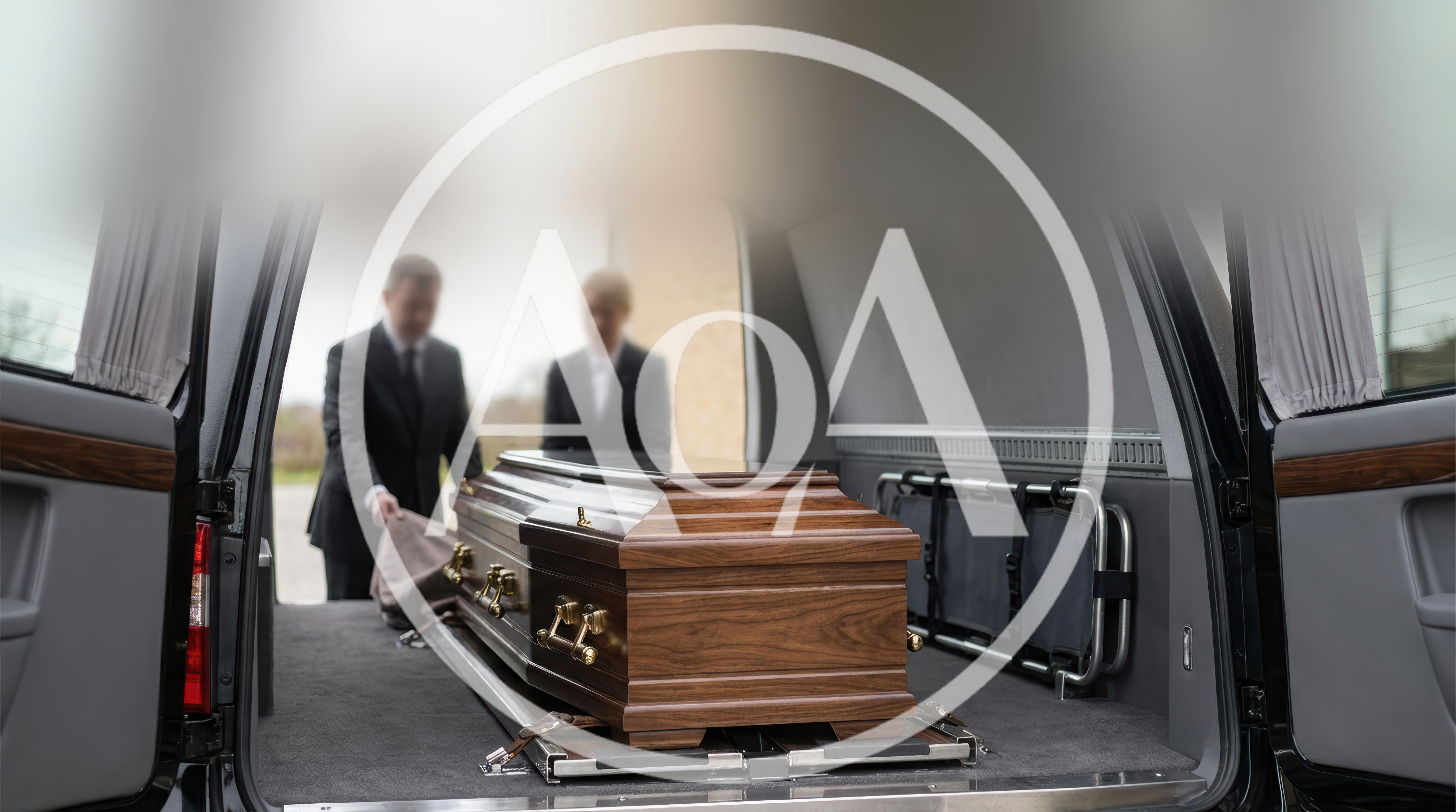 Funeral Directors Loading Casket Into Hearse