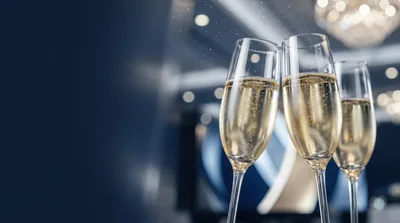 Three Champagne Flutes Toasting At A Formal Event