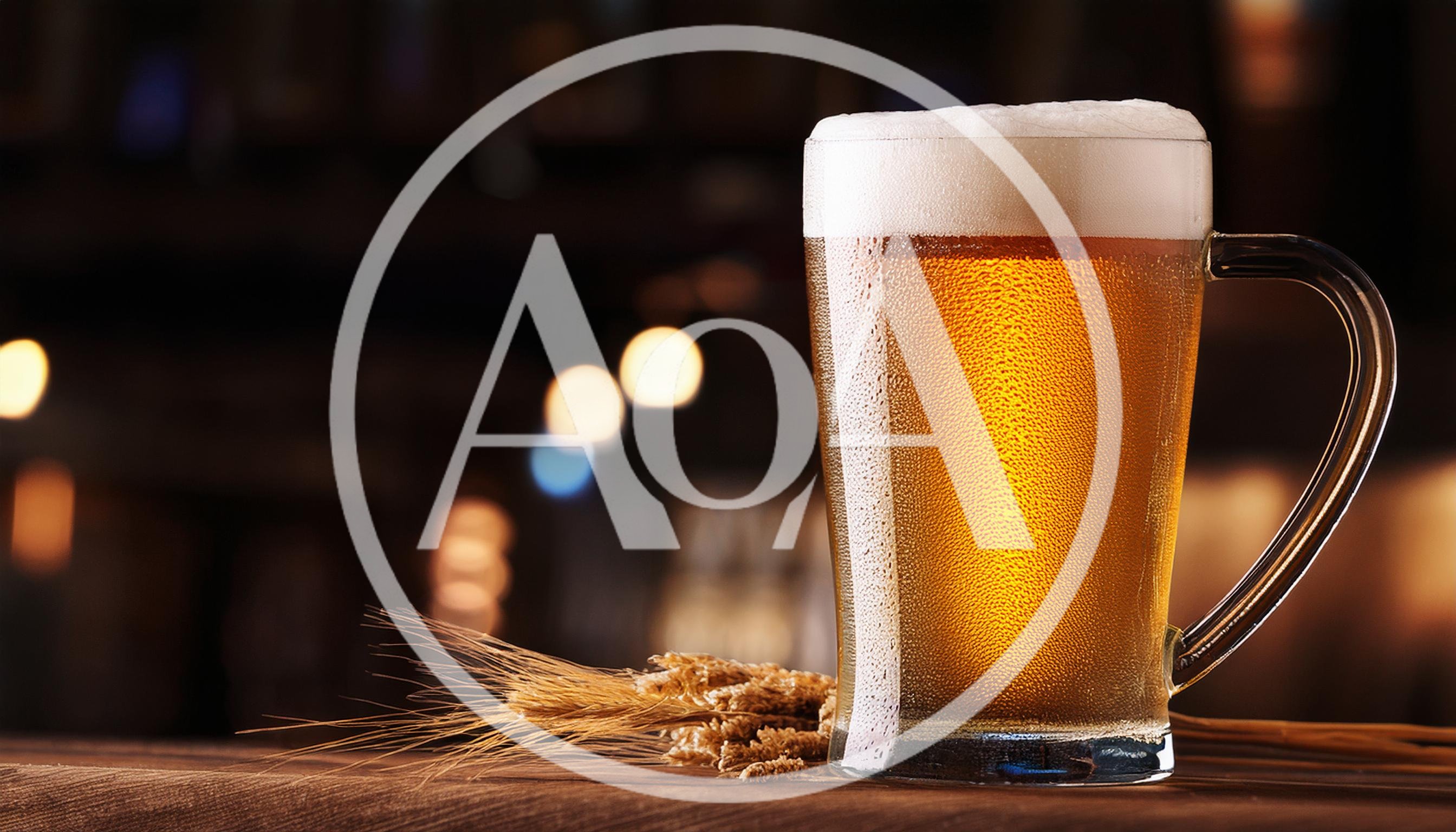 Cold Glass Of Beer With Wheat Stalks