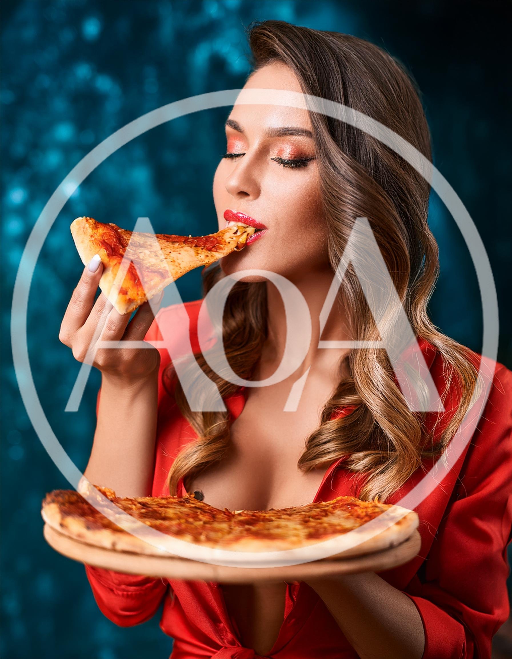 Beautiful Woman Eating Pizza Slice Against Blue Background