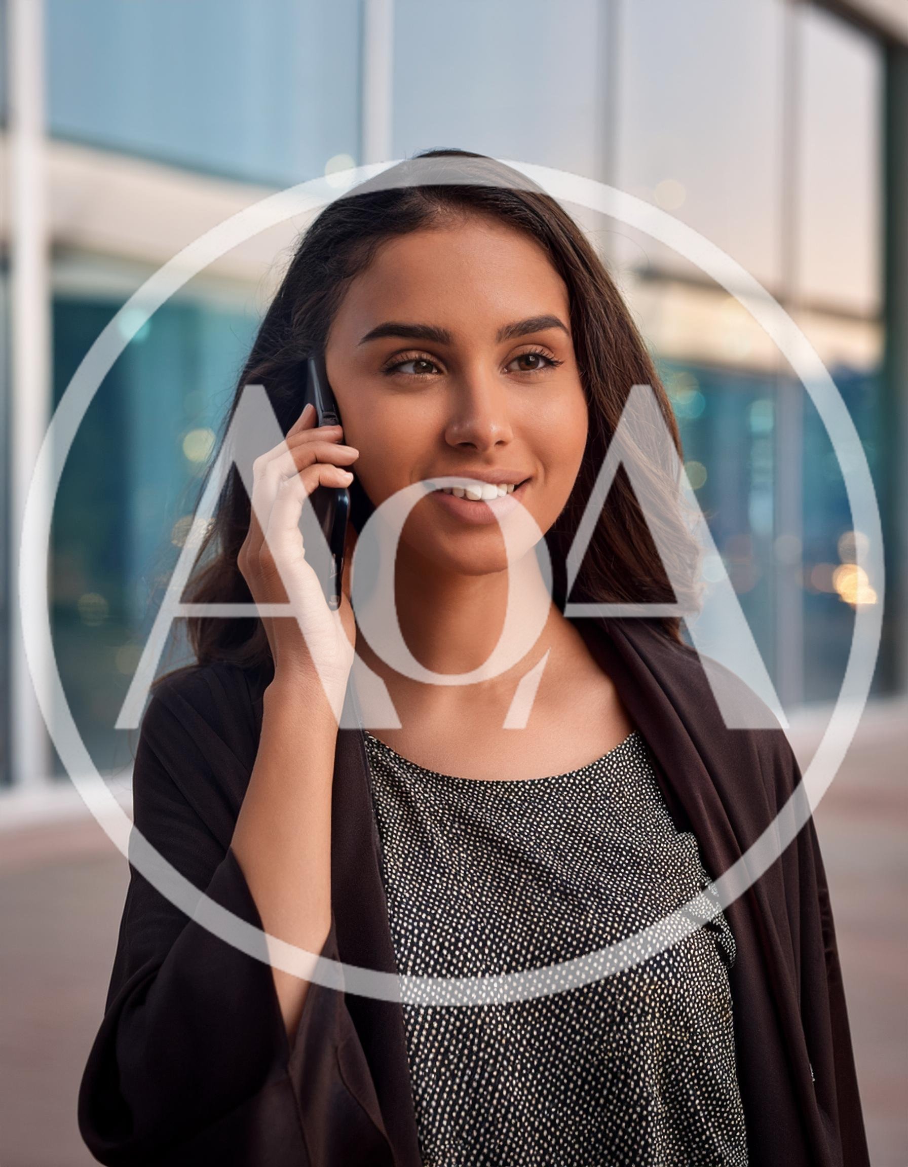 Young Professional Woman Talking On Smartphone Outdoors