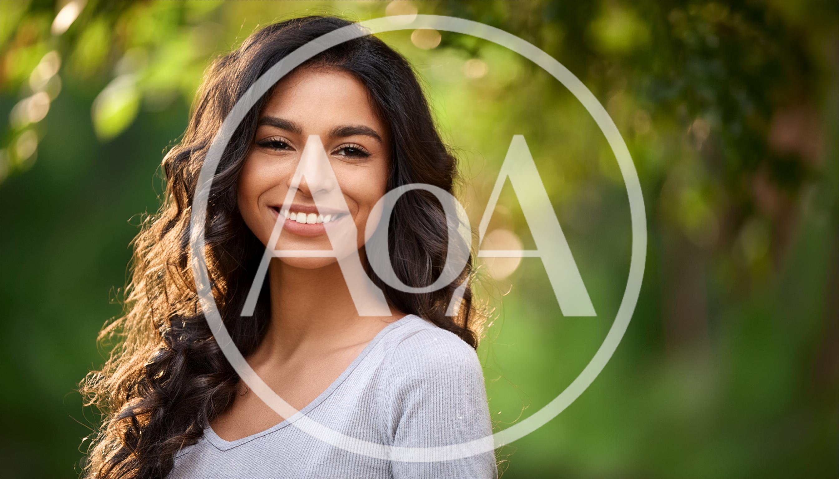 Portrait Of A Smiling Young Woman Outdoors