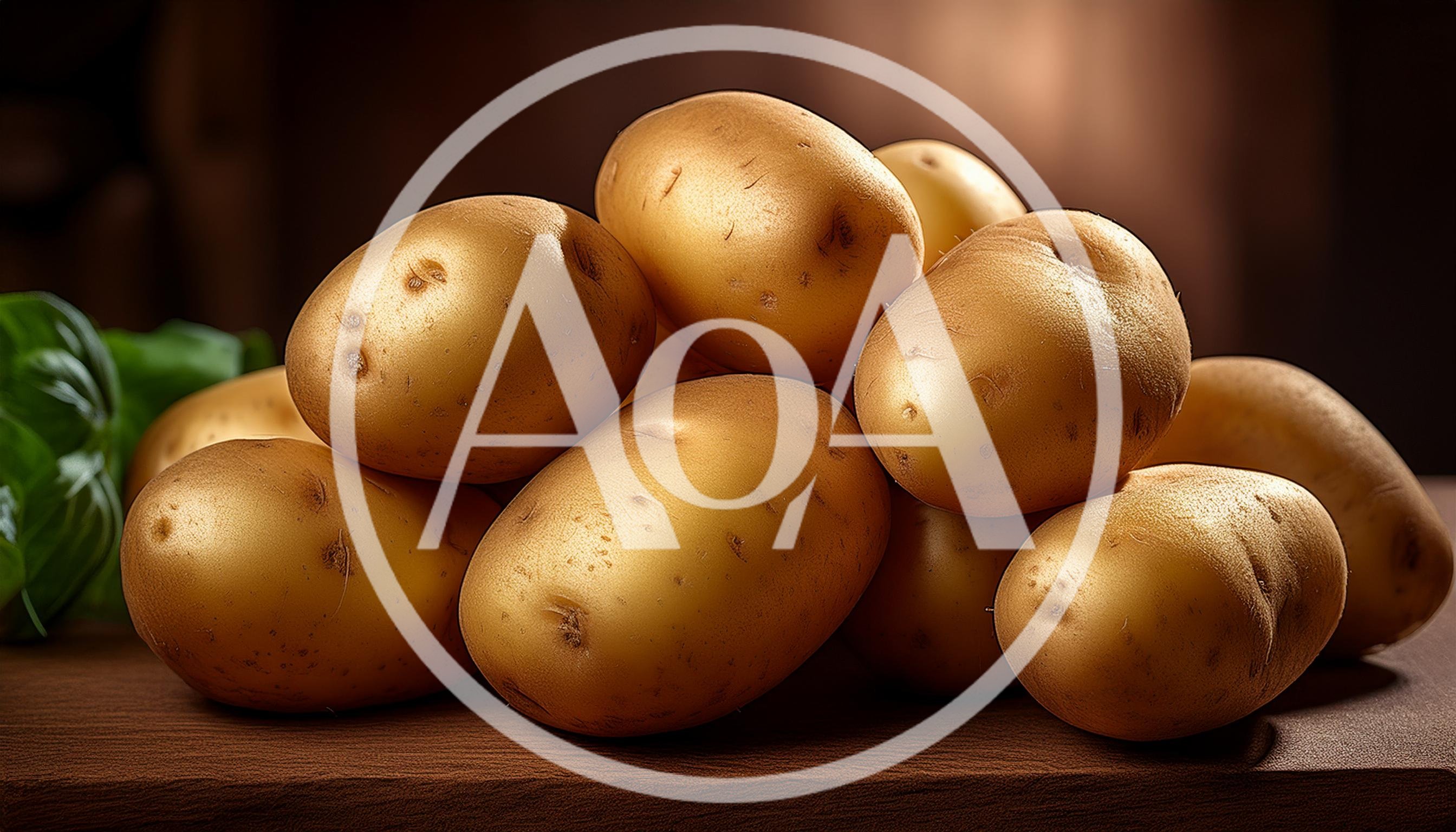 Fresh Raw Potatoes Stacked On A Wooden Surface