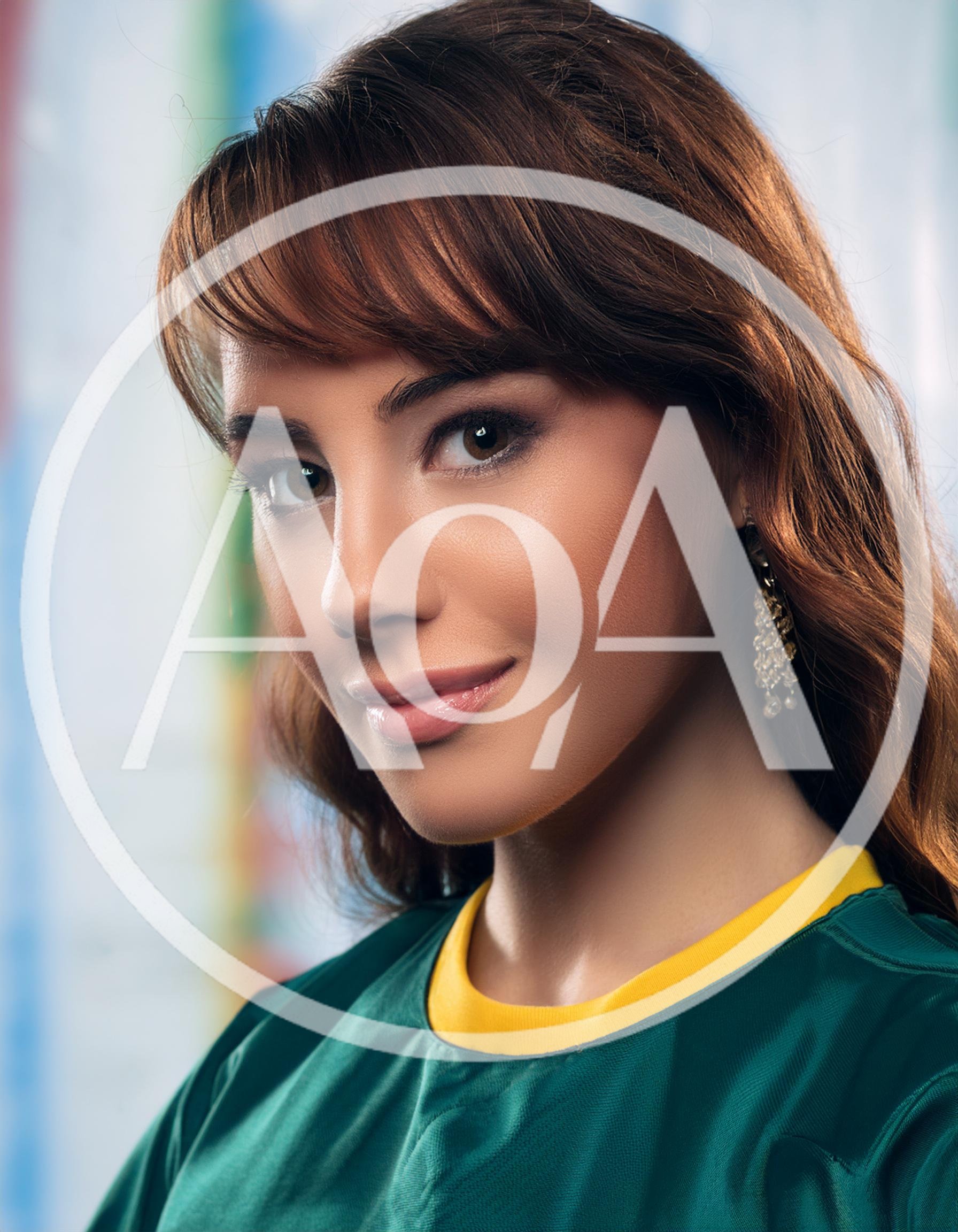 Portrait Of A Young Woman In A Green Jersey