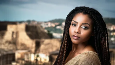 Portrait Of A Young Woman With Braided Hair