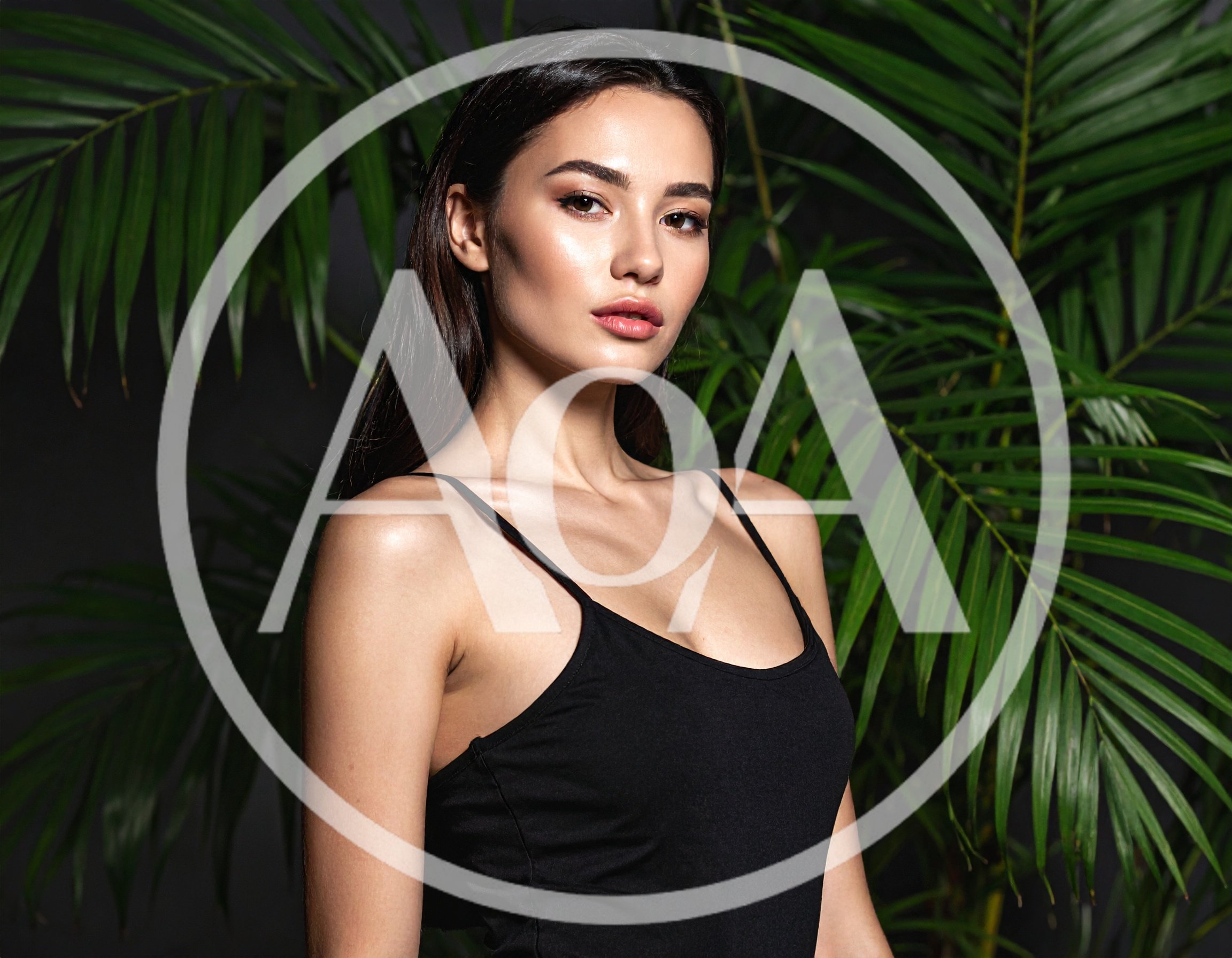 Portrait Of A Beautiful Woman With Tropical Leaves