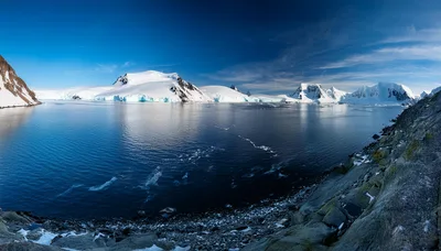 Panoramic View of Snowy Antarctic Mountains and Glaciers