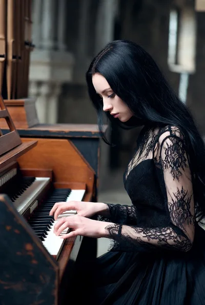 Gothic Woman Playing A Vintage Pipe Organ