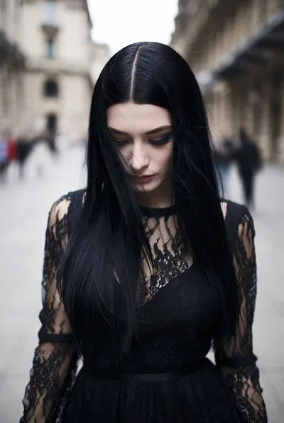Young Woman With Long Black Hair In Lace Dress