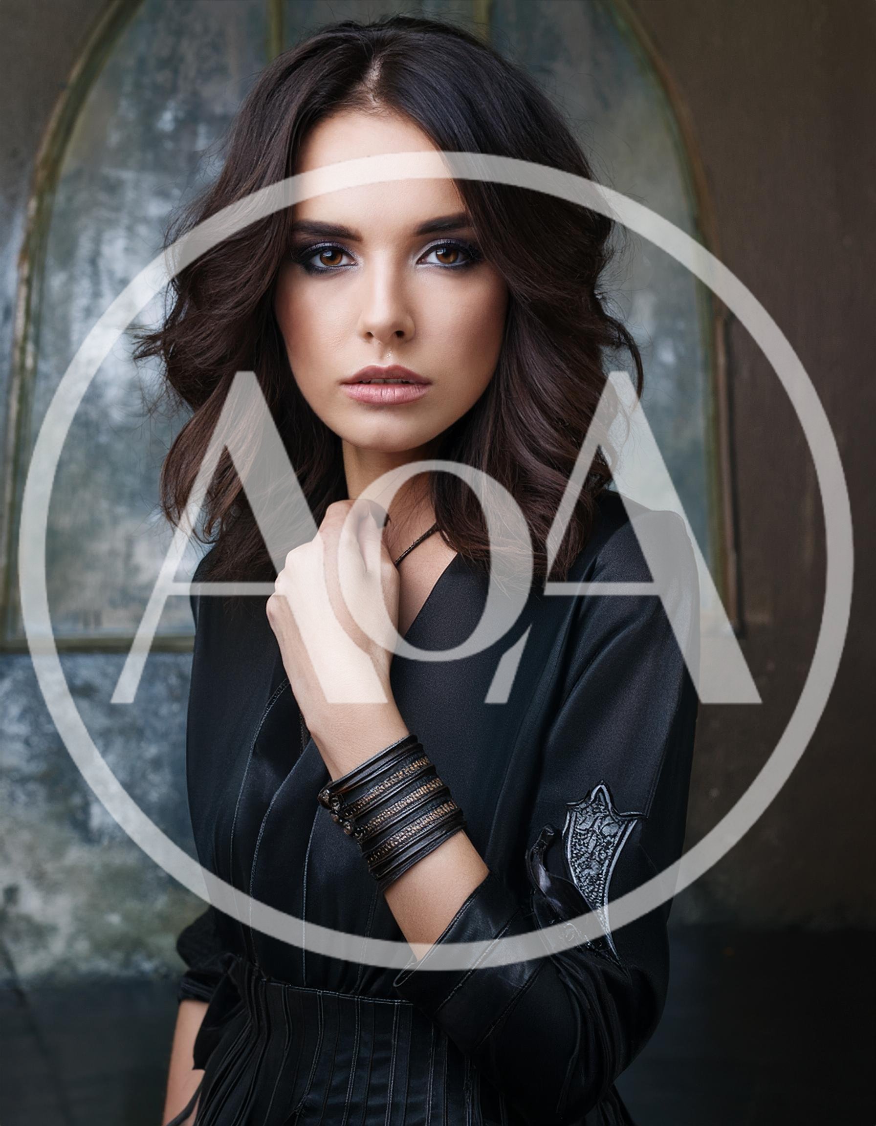 Portrait Of A Stylish Woman In Black Dress