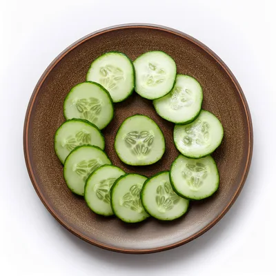 Fresh Cucumber Slices Arranged On A Brown Plate