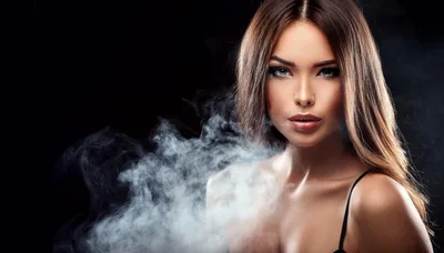 Beautiful Woman With Long Hair Surrounded By Smoke