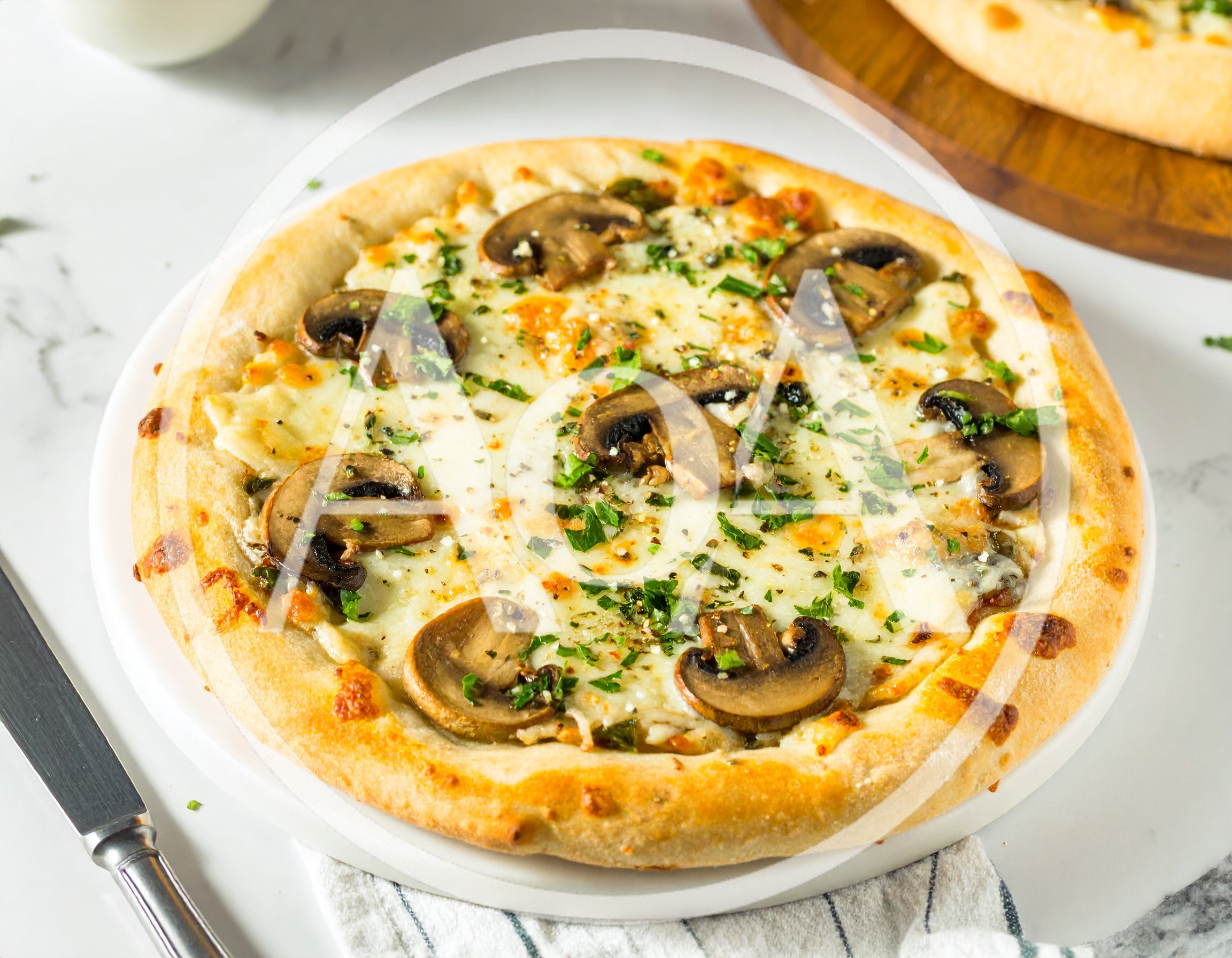 Freshly Baked Mushroom Pizza On A White Plate