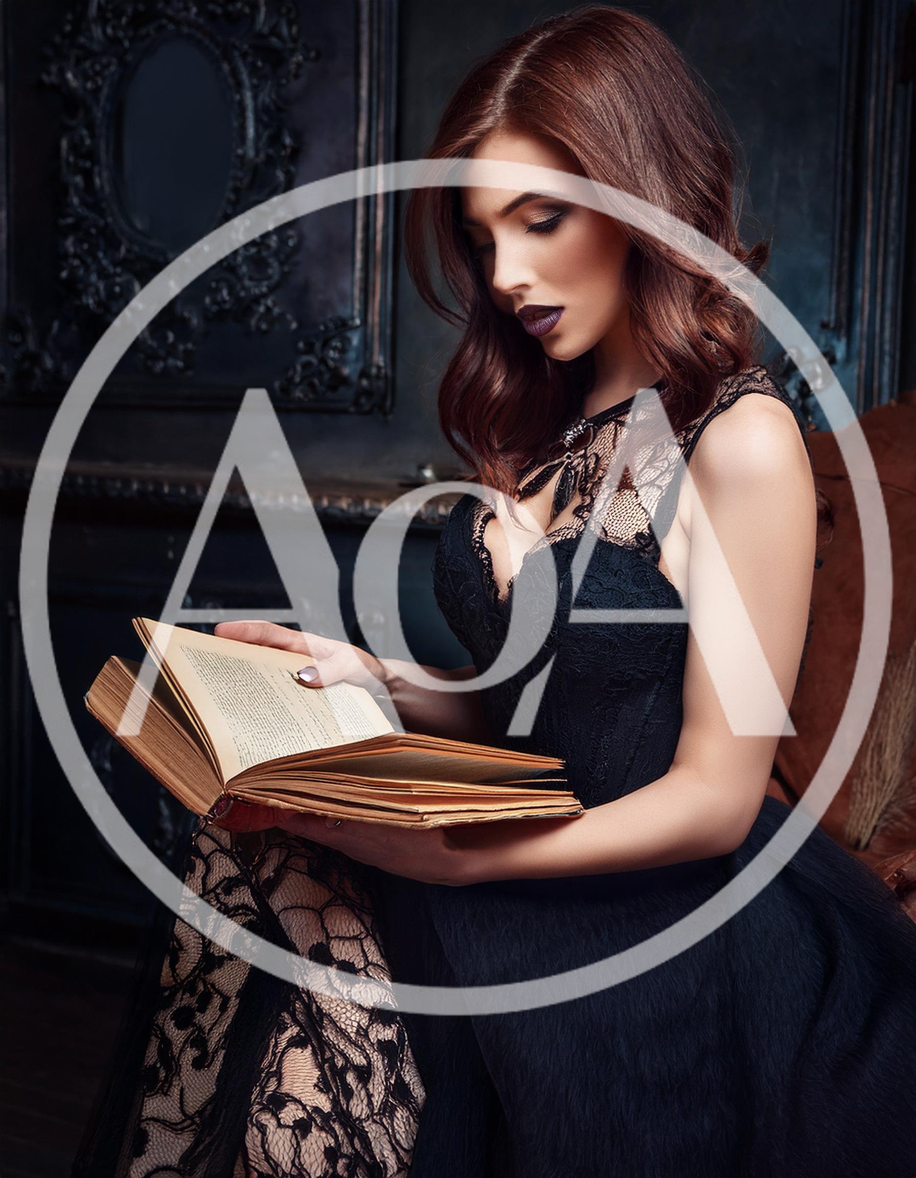 Elegant Woman Reading An Antique Book In Dark Interior