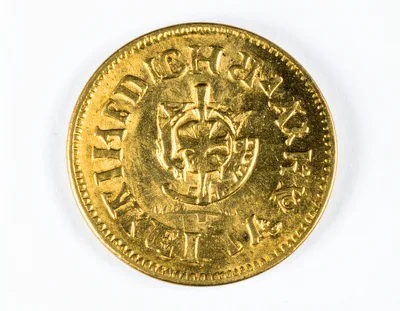 Close Up Of An Antique Gold Coin