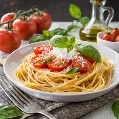 Spaghetti Pasta With Cherry Tomatoes And Fresh Basil