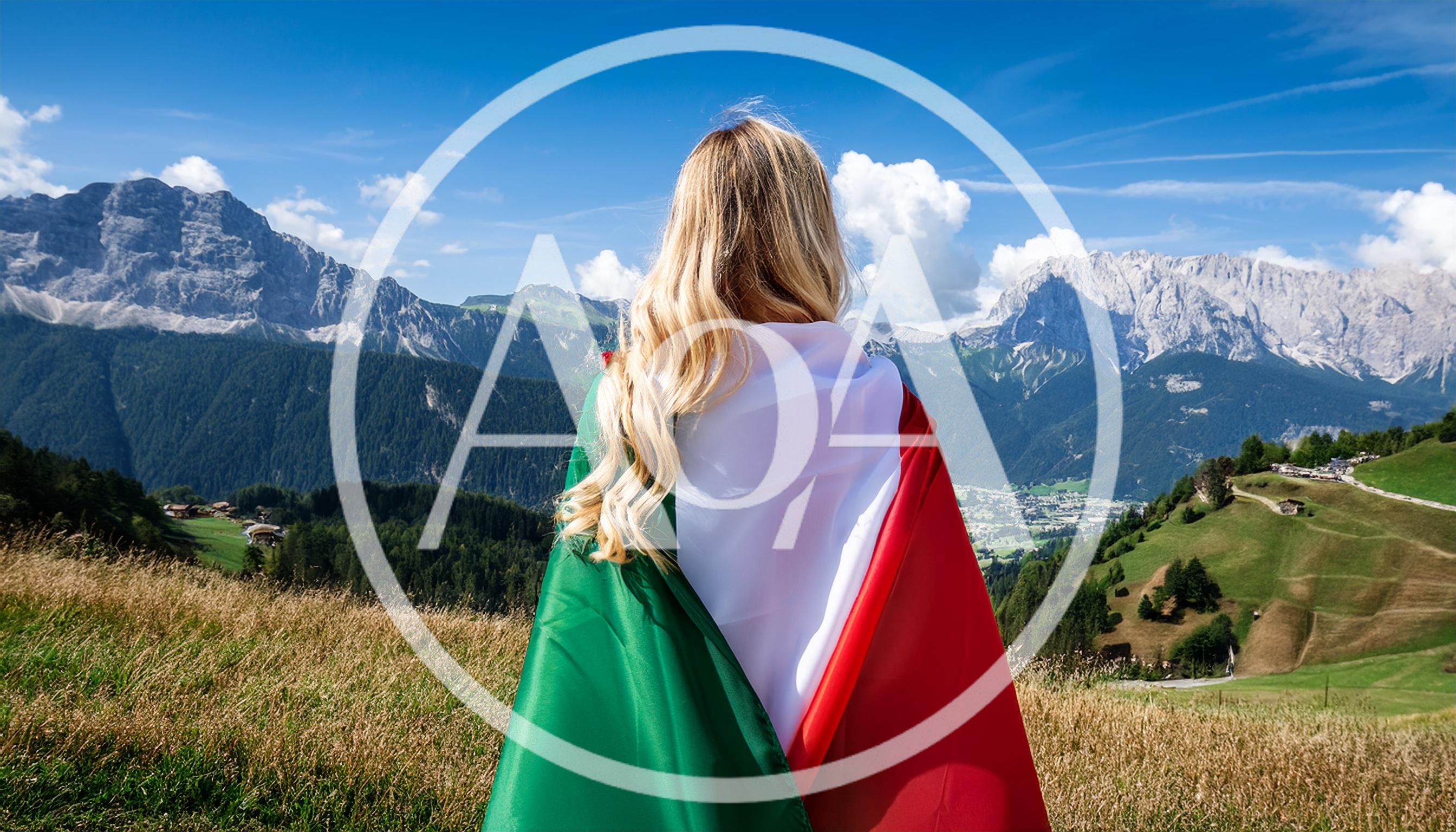 Woman Standing With Italian Flag Overlooking Alpine Mountains