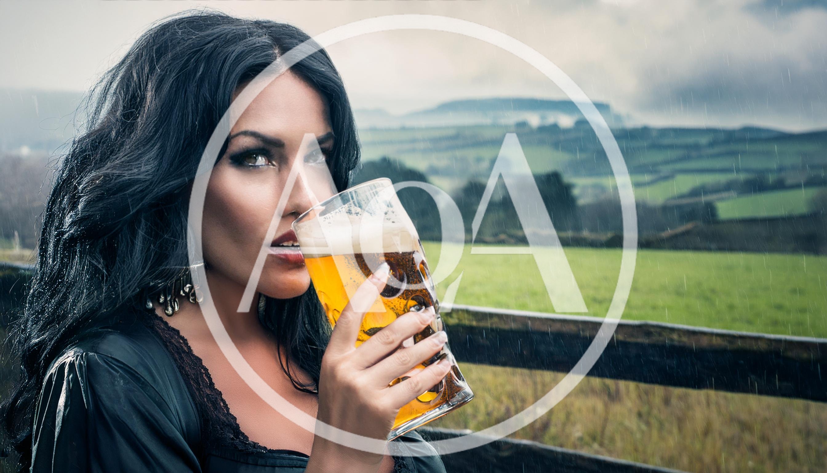 Beautiful Woman Drinking Beer Outdoors In The Rain