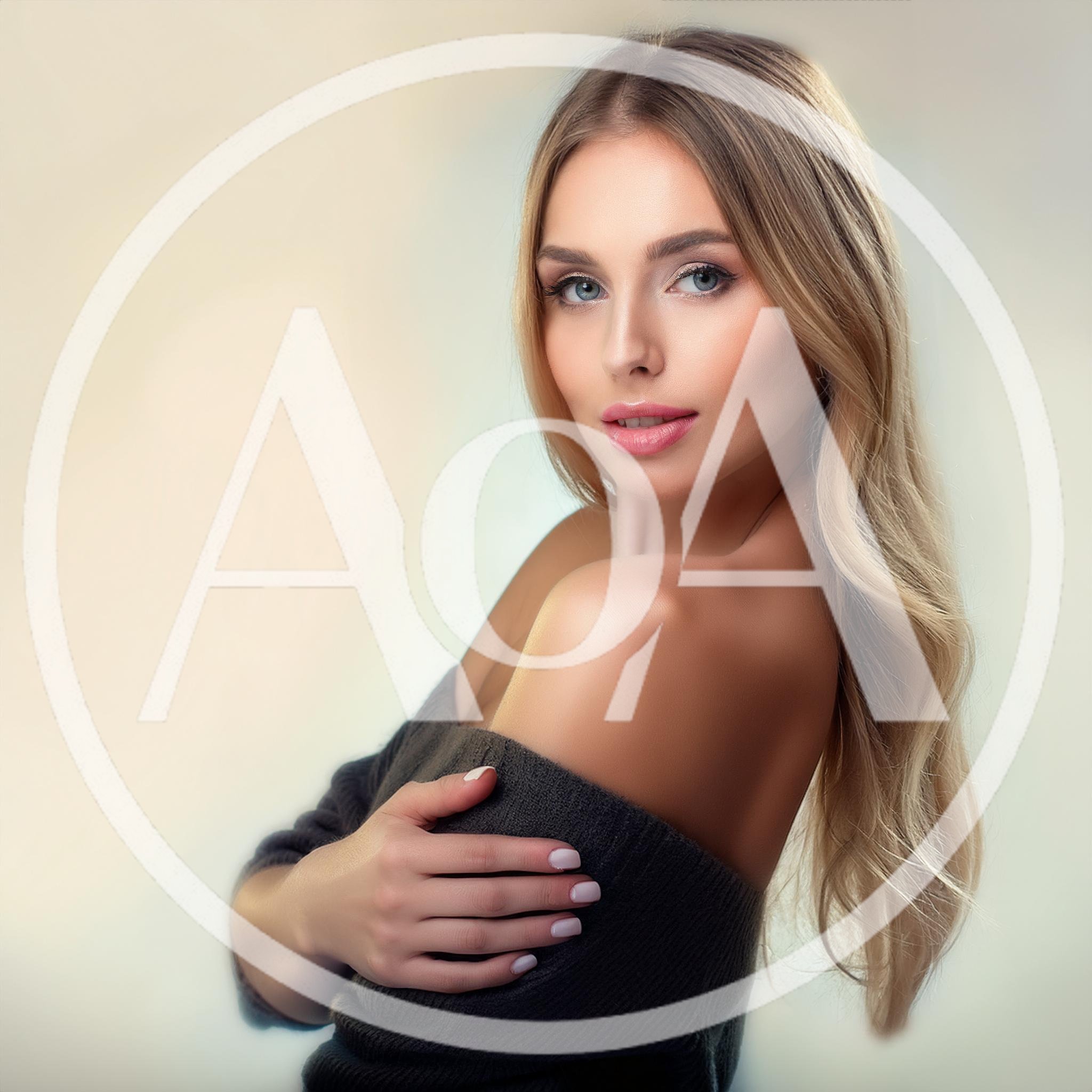 Portrait Of A Beautiful Blonde Woman In A Sweater