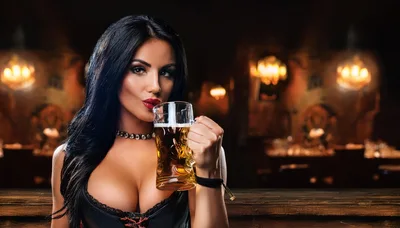 Beautiful Woman Drinking Beer In A Pub