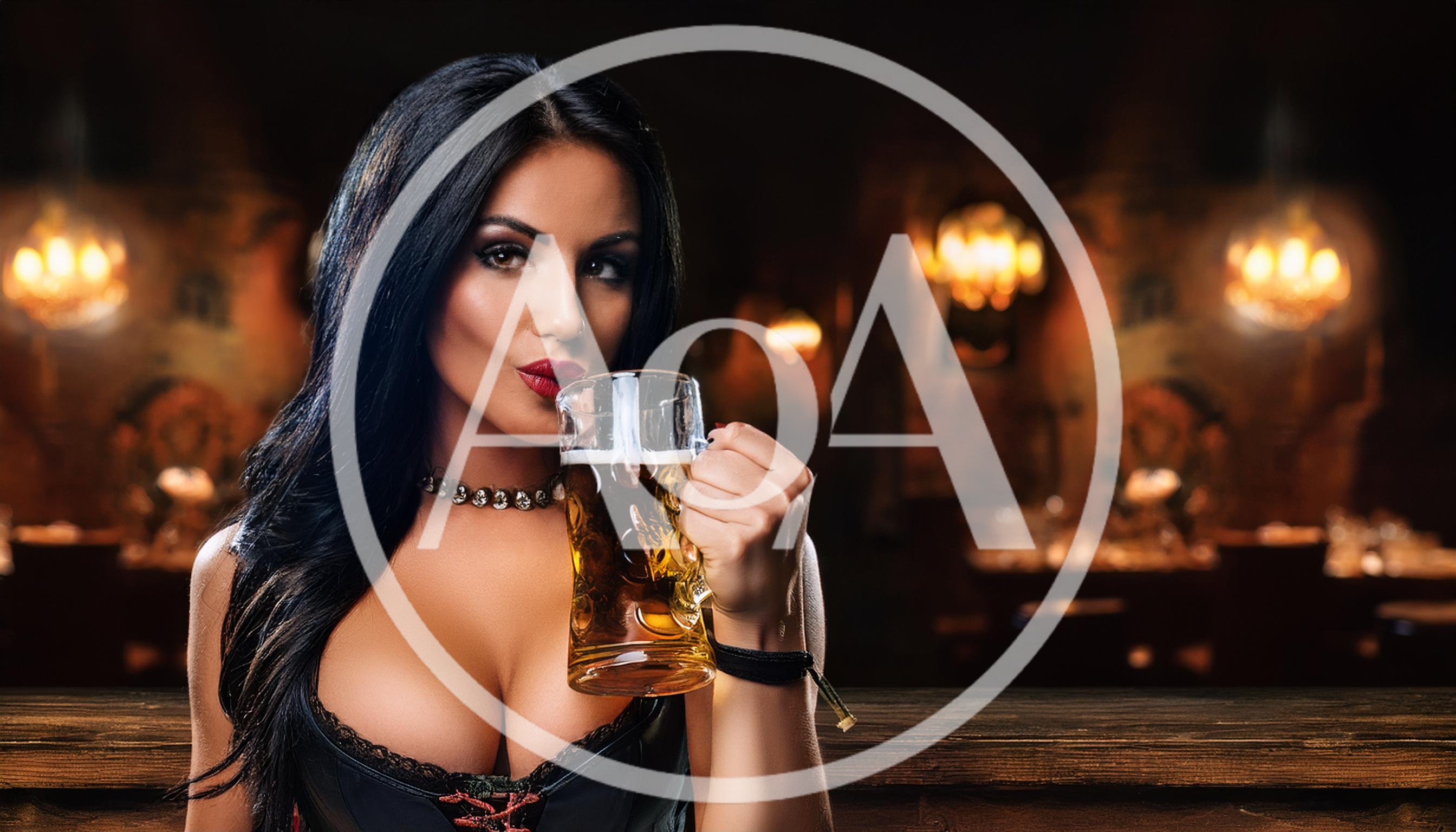 Beautiful Woman Drinking Beer In A Pub