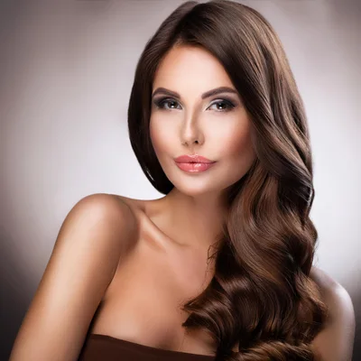 Portrait Of A Beautiful Woman With Wavy Brown Hair