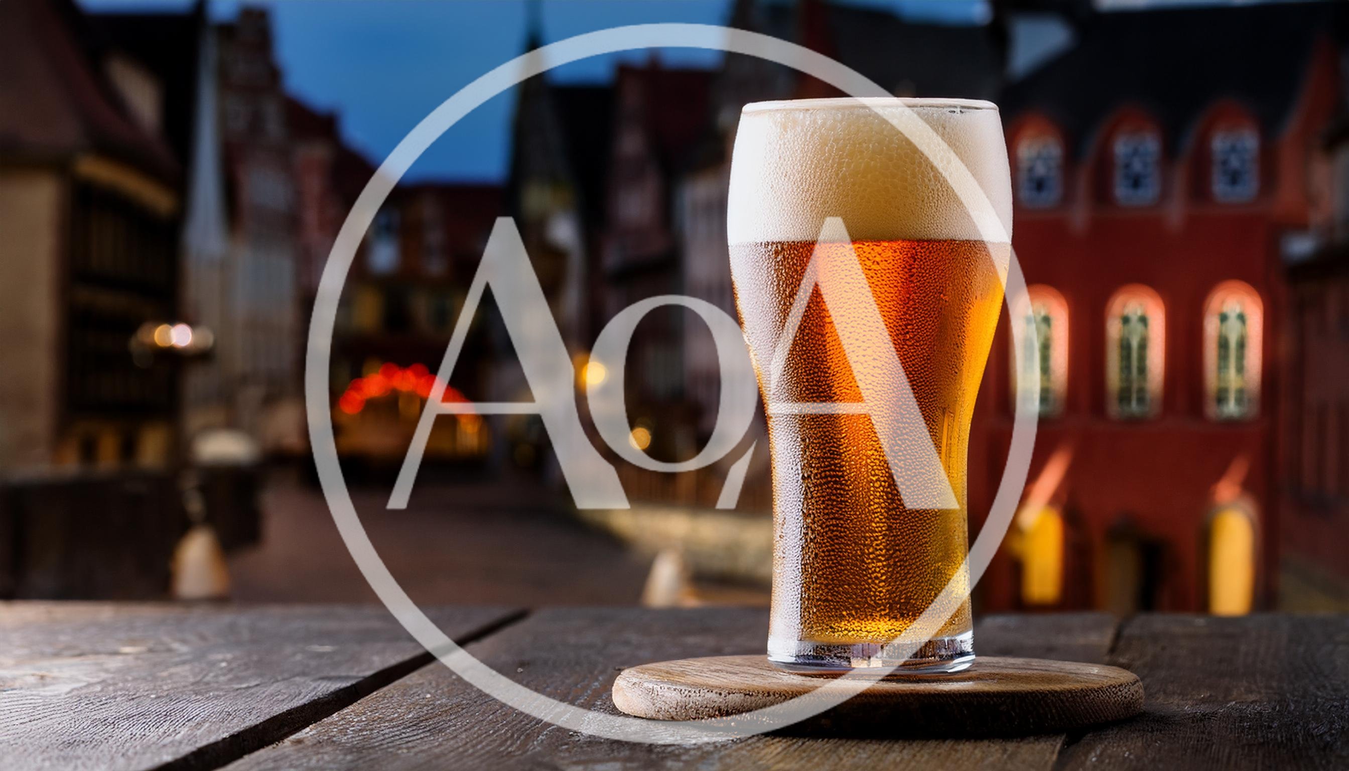Cold Glass Of Beer On A Wooden Table