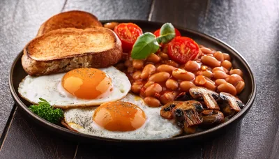 Traditional English Breakfast With Eggs Beans And Toast