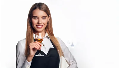 Smiling Female Sommelier Holding A Glass Of Wine