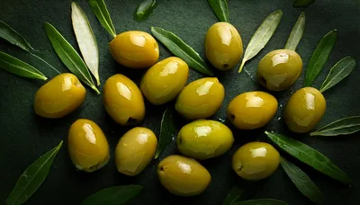 Fresh Green Olives With Leaves On Dark Background