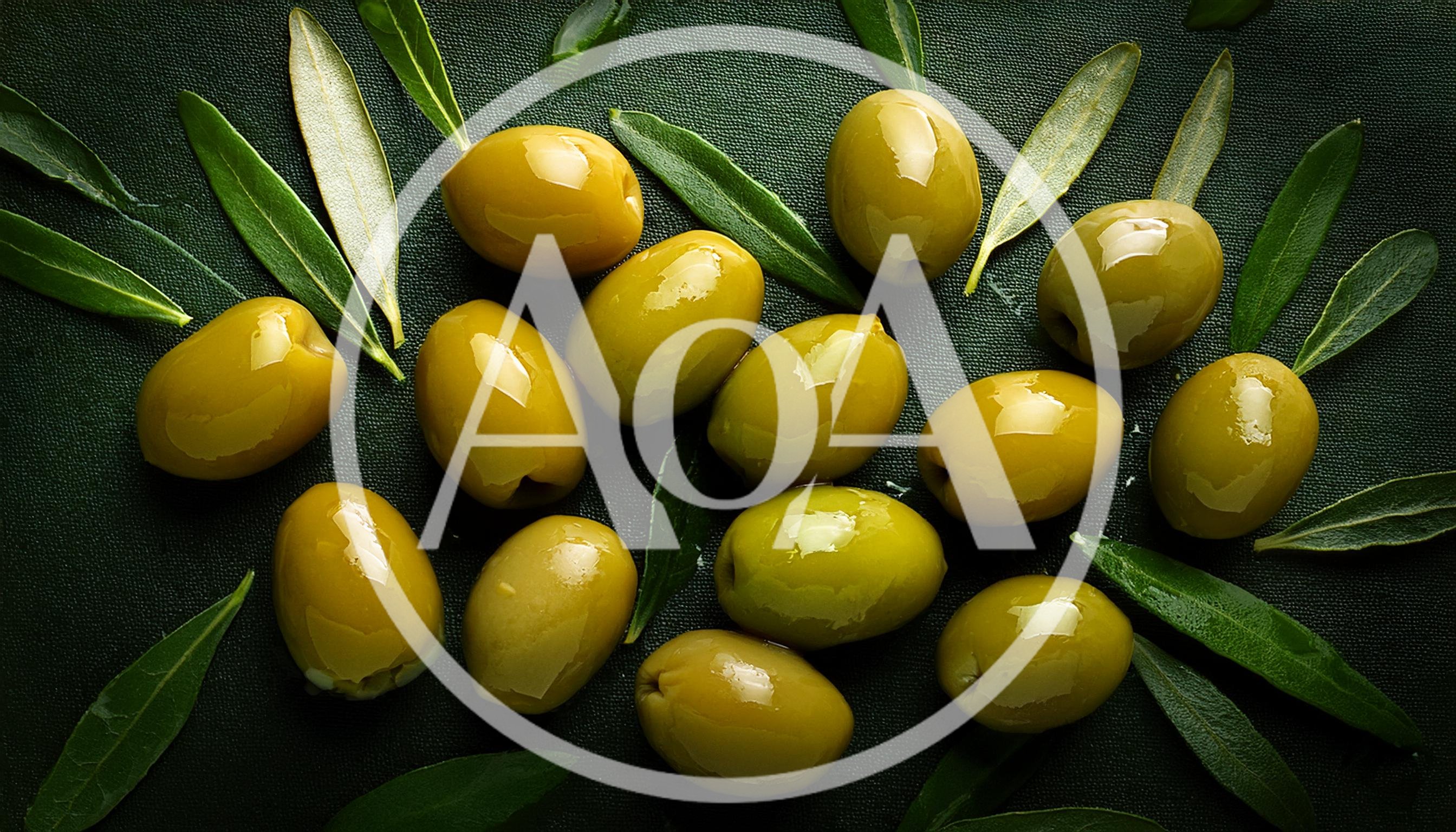 Fresh Green Olives With Leaves On Dark Background