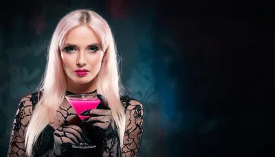 Portrait Of A Woman With Pink Hair Holding A Cocktail