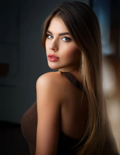 Portrait Of A Beautiful Young Woman Looking Back