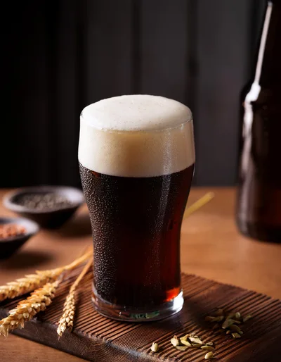 Cold Glass Of Dark Stout Beer With Wheat