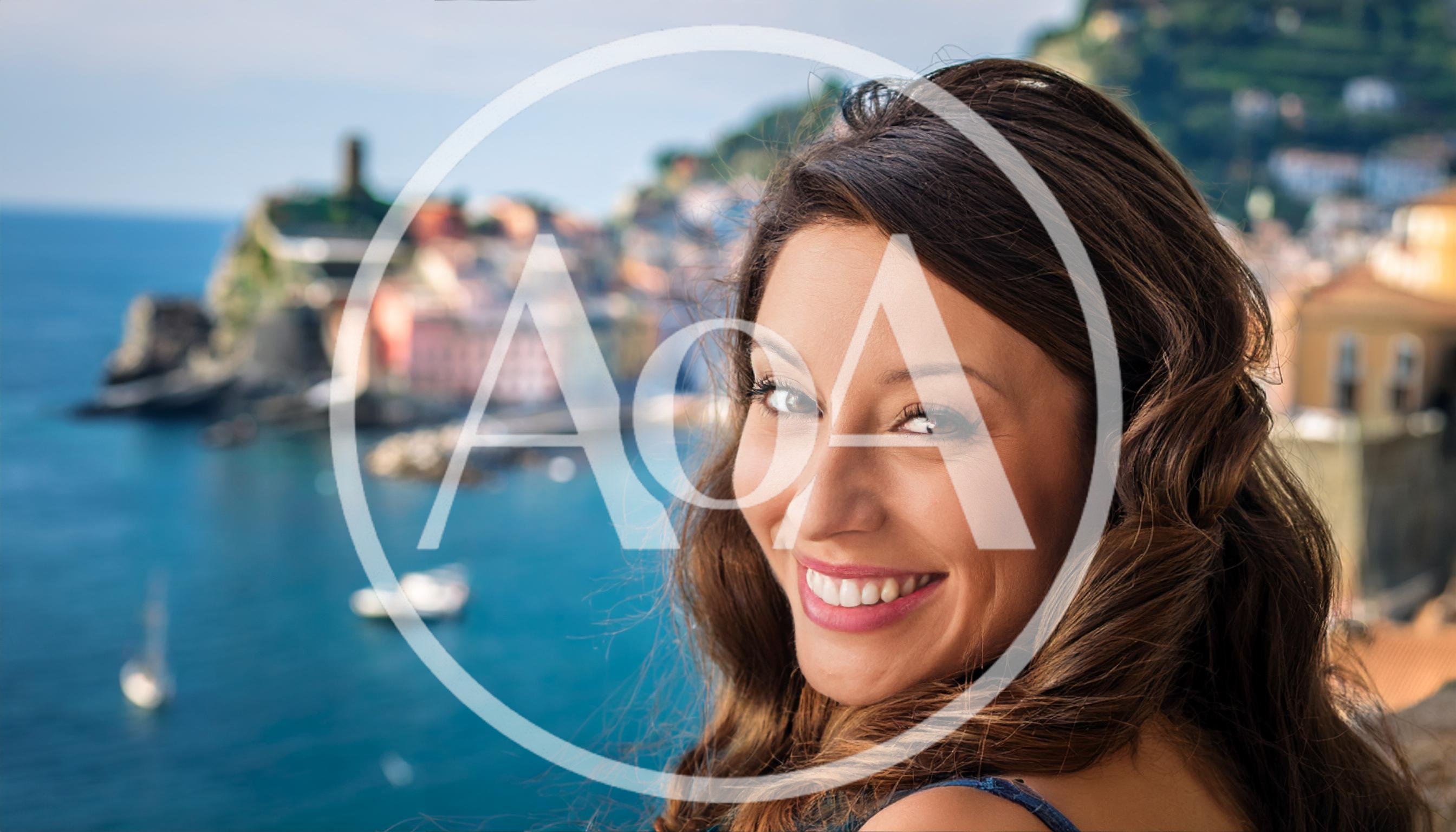 Smiling Woman Looking Over Shoulder In Vernazza Italy